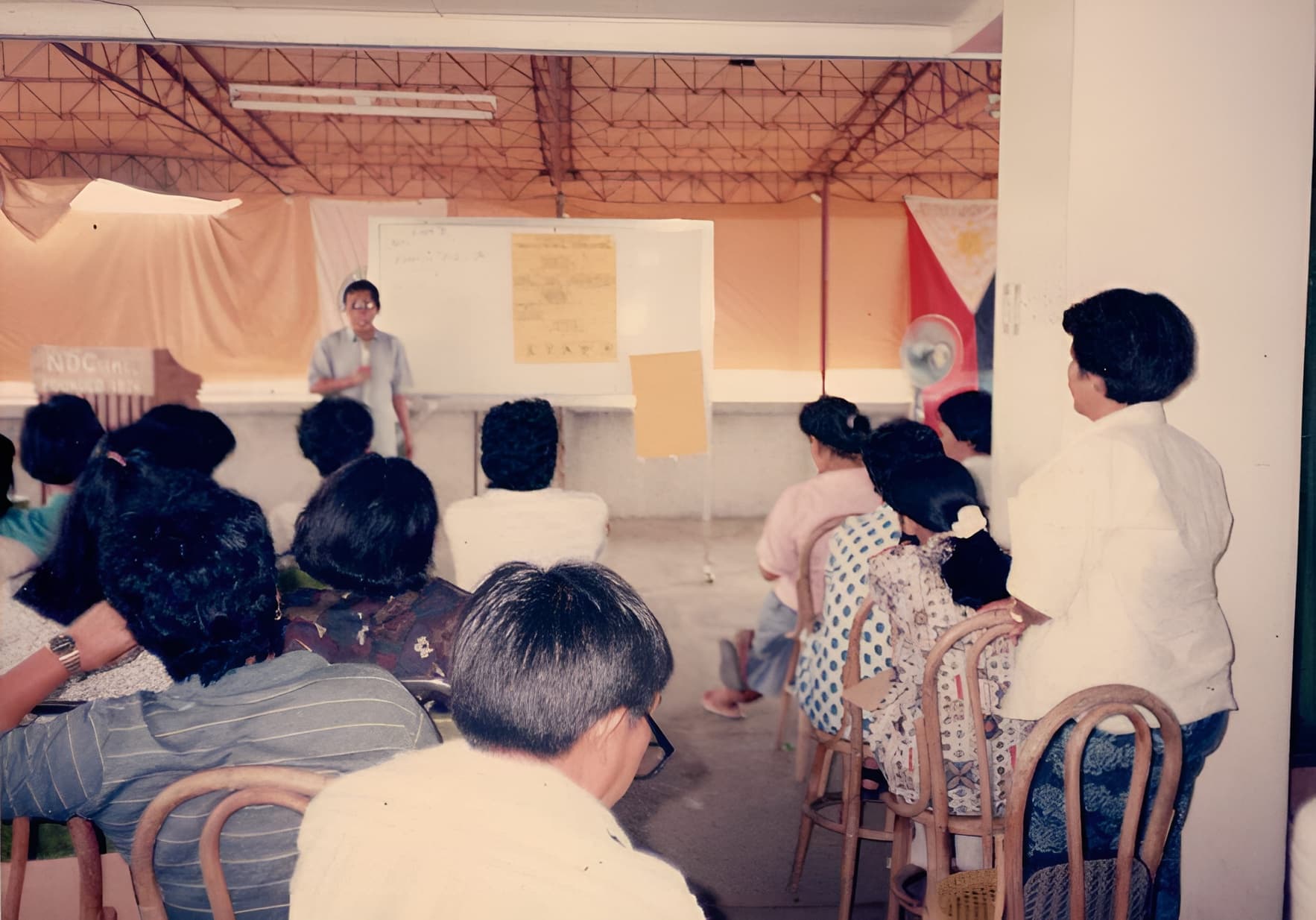 NOVADECI seminar session with members seated facing a presenter