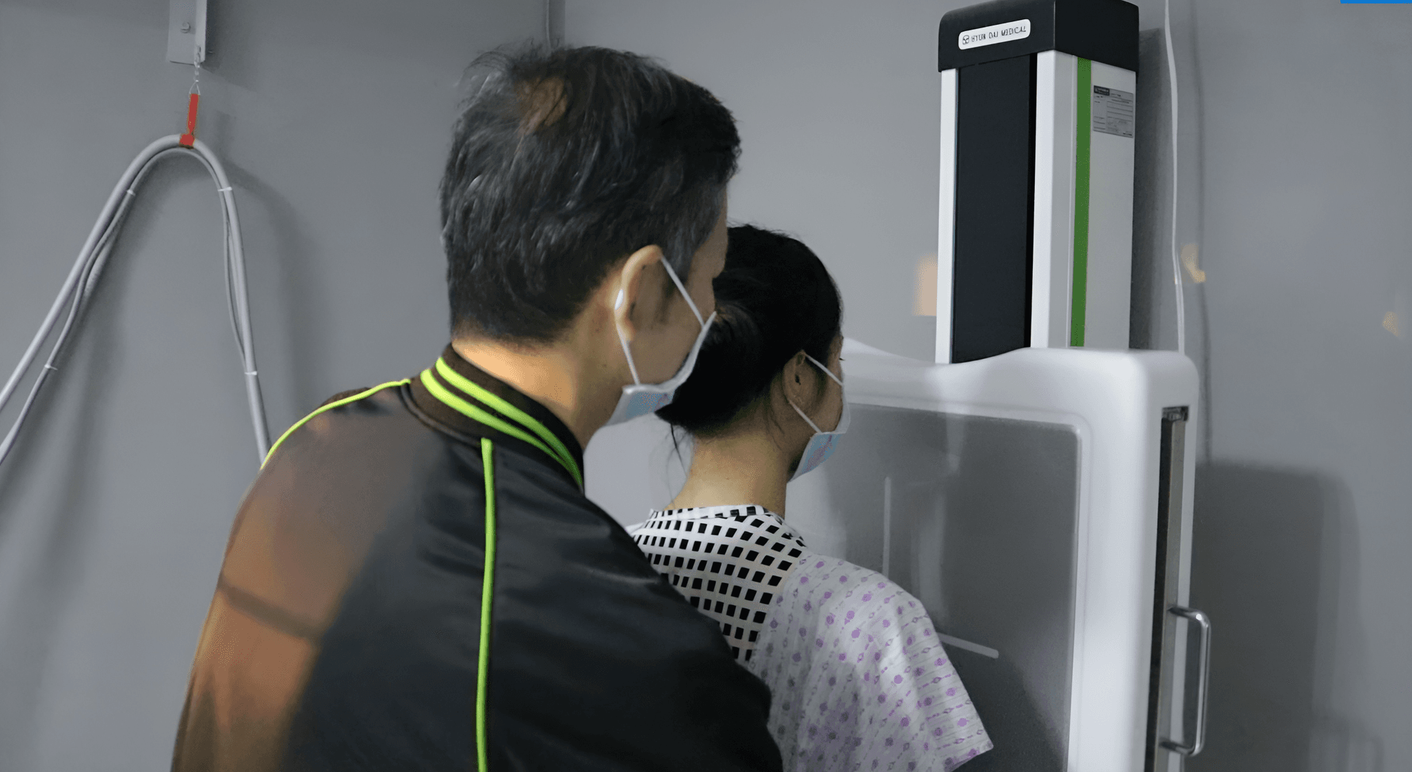 NOVADECI radiology staff assisting a patient with an X-ray procedure