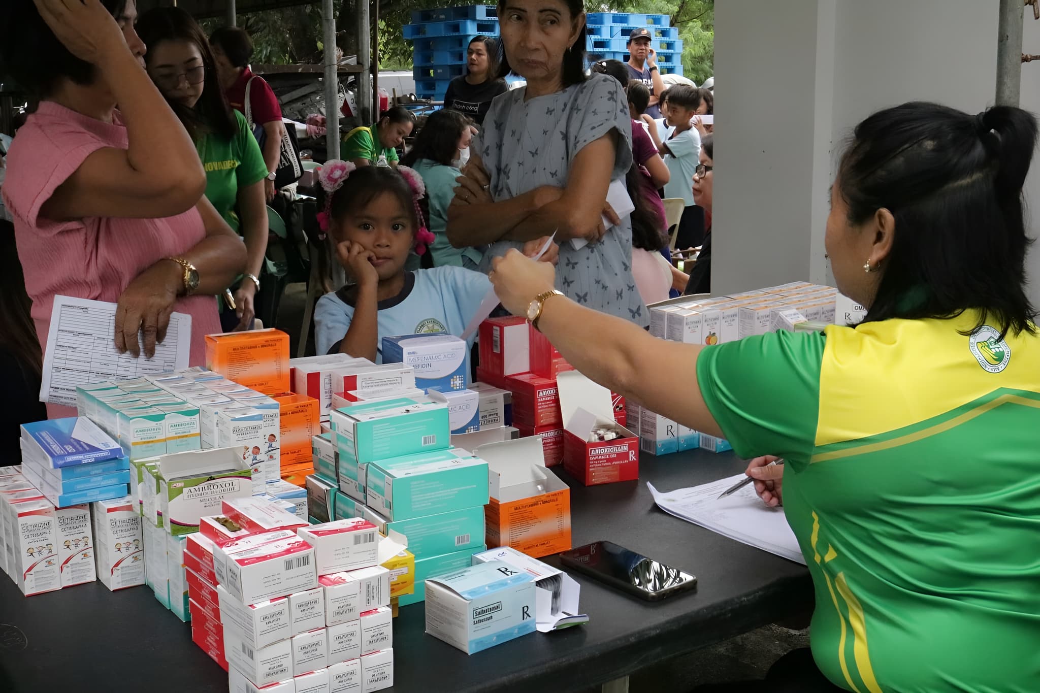 NOVADECI medical staff providing medicines and assistance to members