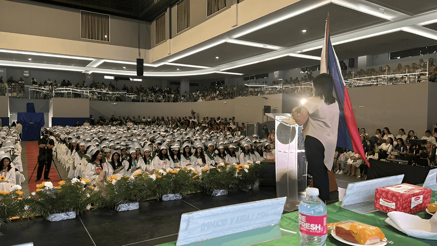 Graduation ceremony in a large auditorium