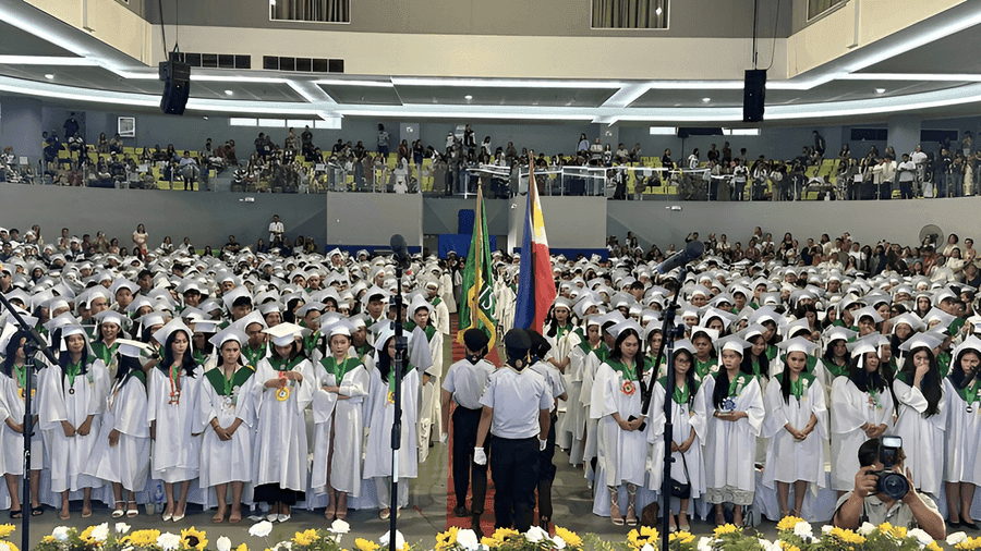 Graduates on stage during a school ceremony