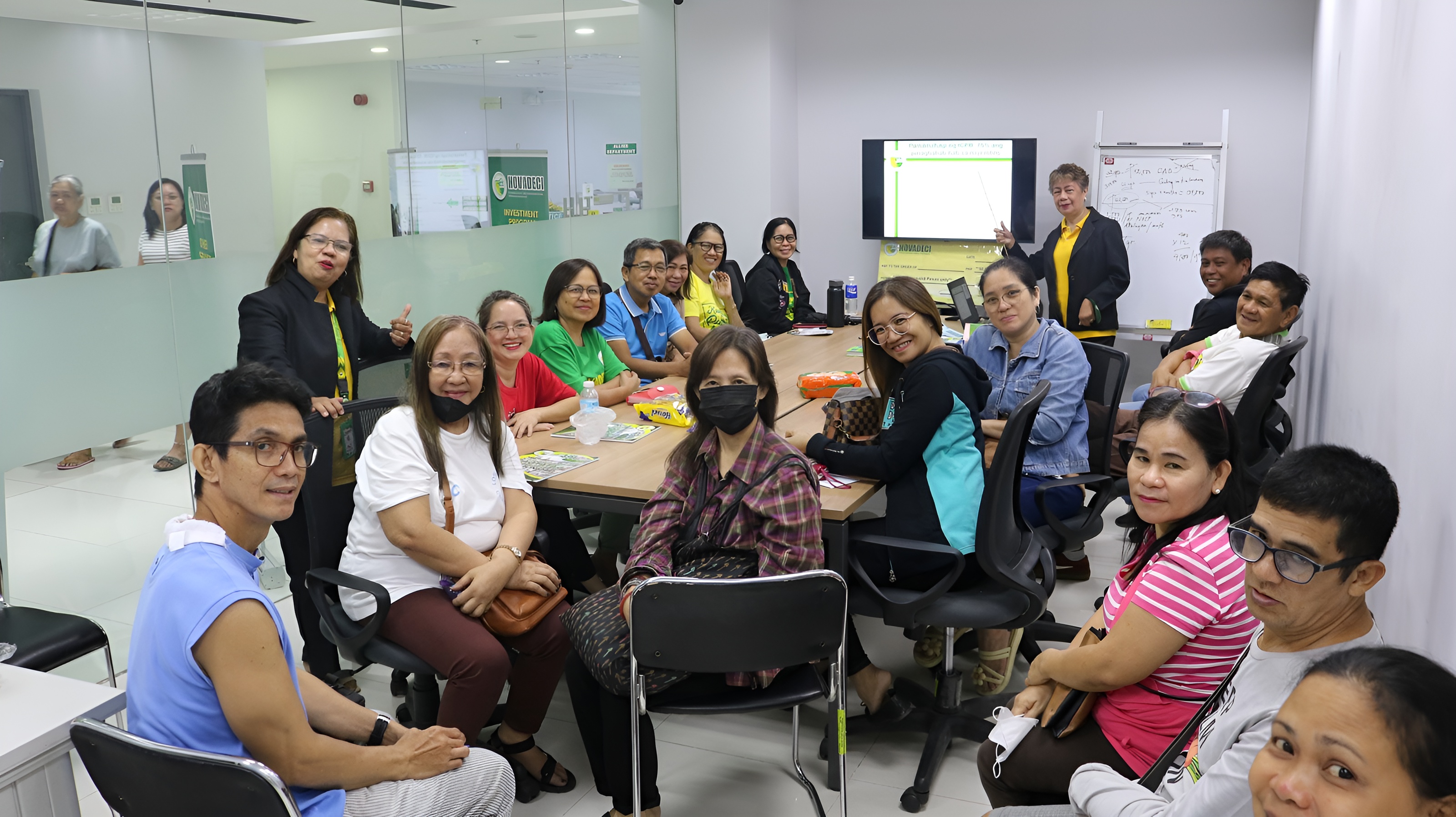 NOVADECI members and staff in a conference room training session